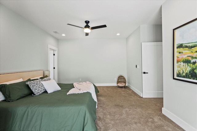 bedroom featuring ceiling fan and carpet