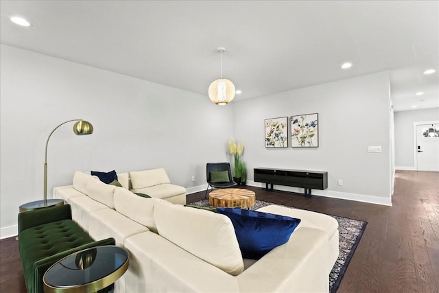 living room featuring dark wood-type flooring