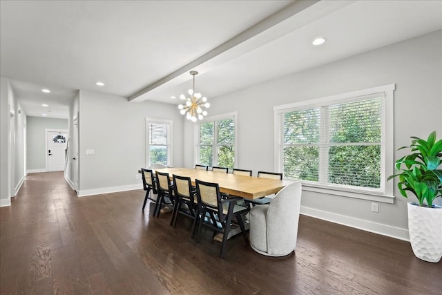 dining area featuring dark wood-type flooring, a notable chandelier, beam ceiling, and a wealth of natural light