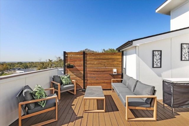 wooden deck featuring outdoor lounge area