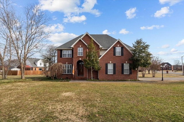 view of property featuring a front lawn