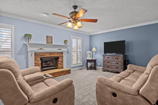 living room with crown molding, carpet flooring, a stone fireplace, and a textured ceiling