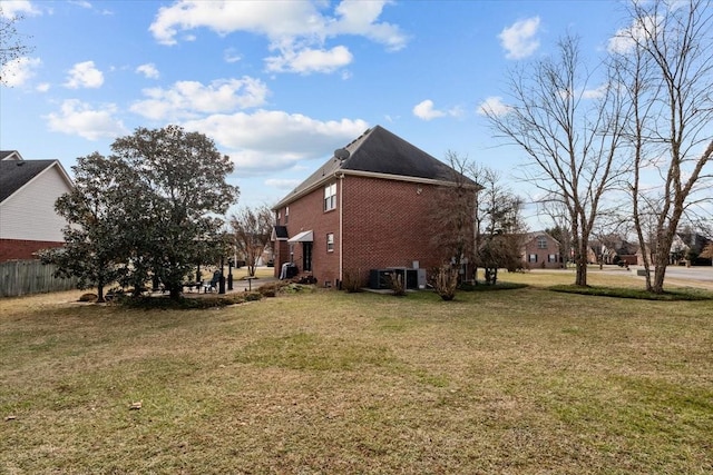 view of side of property with a lawn