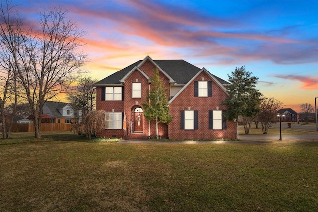 view of front of property with a lawn