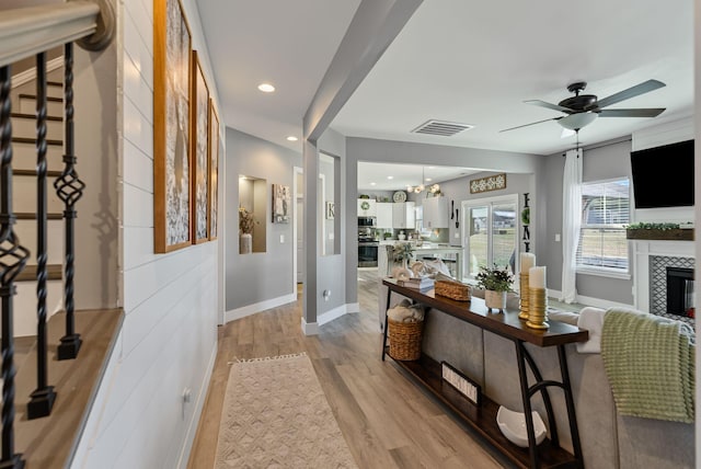 corridor featuring light hardwood / wood-style floors