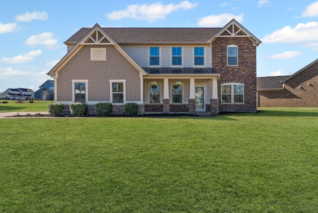 craftsman-style house with covered porch and a front yard