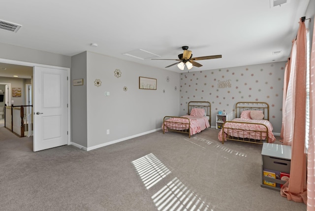 unfurnished bedroom featuring ceiling fan and carpet