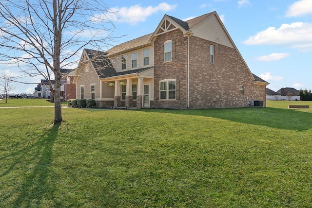 exterior space featuring central AC unit and a yard