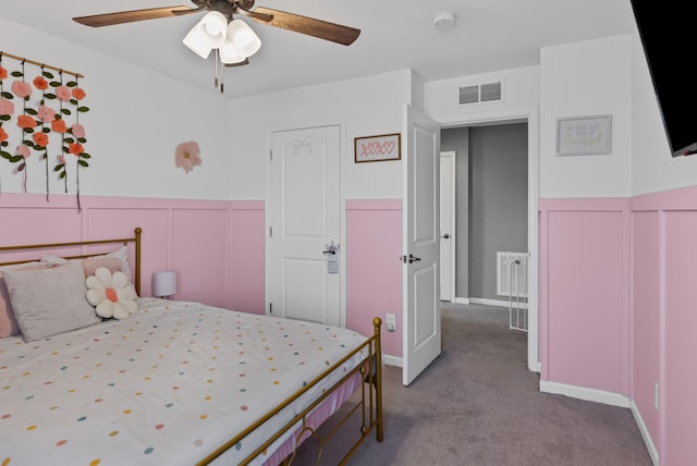 carpeted bedroom featuring ceiling fan