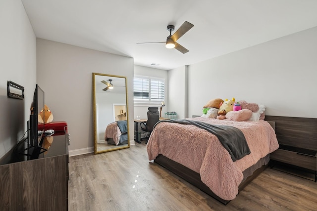 bedroom featuring light hardwood / wood-style floors and ceiling fan