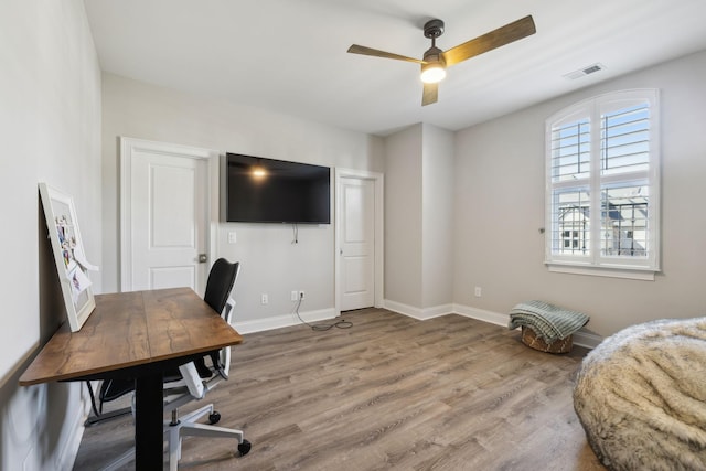 office featuring hardwood / wood-style flooring and ceiling fan