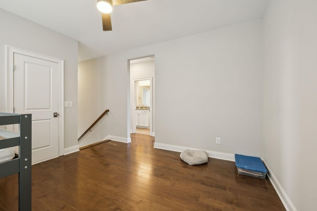 spare room with ceiling fan and dark hardwood / wood-style flooring