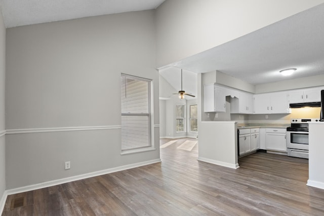 kitchen featuring white cabinetry, wood-type flooring, ceiling fan, and stainless steel range with electric stovetop