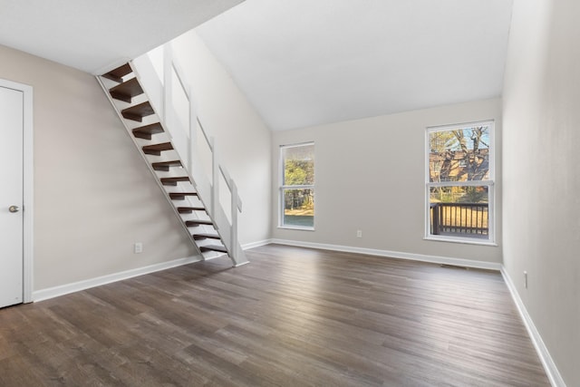 unfurnished living room with dark hardwood / wood-style floors