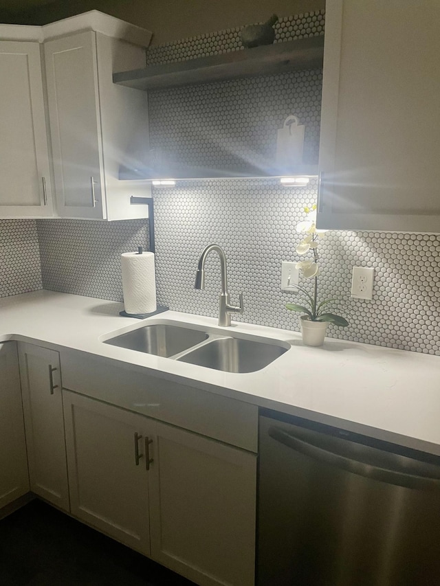 kitchen with sink, decorative backsplash, and dishwasher