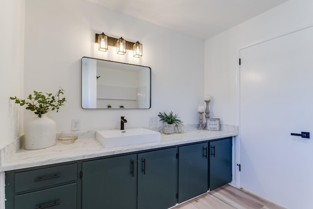 bathroom with vanity and wood-type flooring