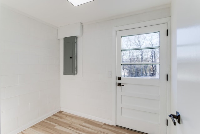 entryway with hardwood / wood-style flooring and electric panel