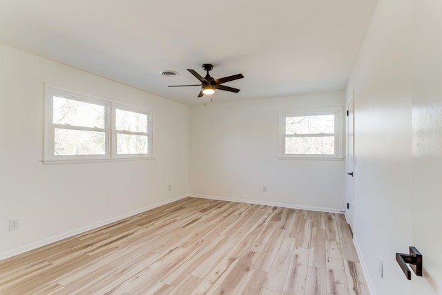 unfurnished room with ceiling fan and light wood-type flooring