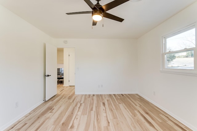 unfurnished room with ceiling fan and light wood-type flooring