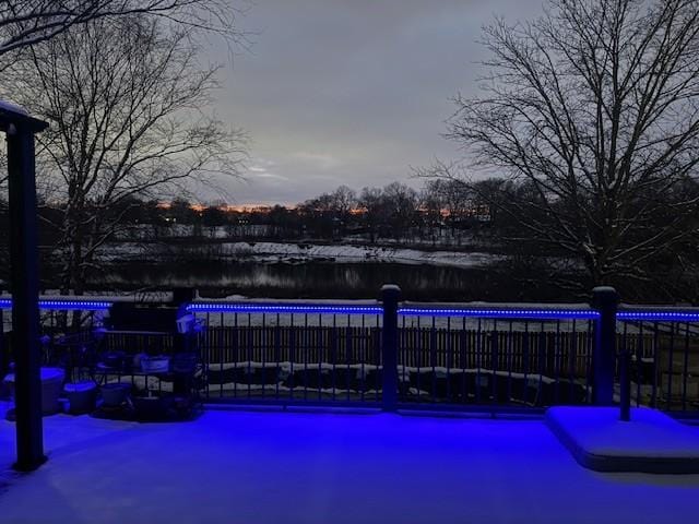 pool at dusk with a water view