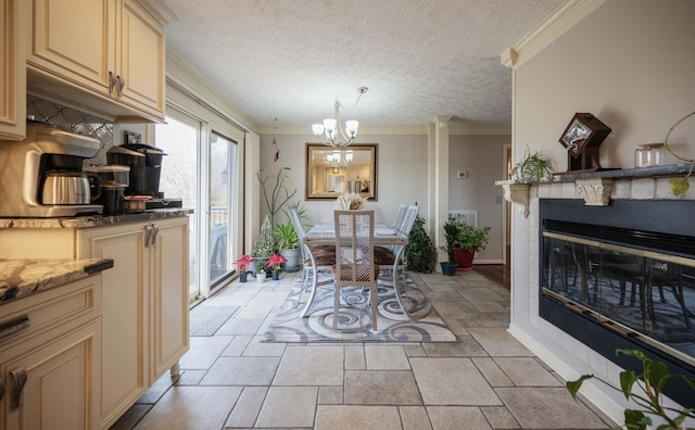 dining area with crown molding, a chandelier, and a textured ceiling