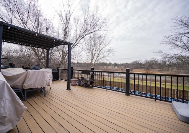 wooden deck featuring a pergola