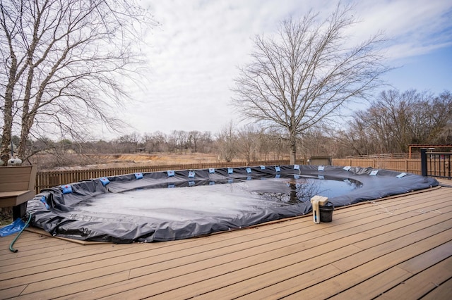 wooden terrace featuring a covered pool