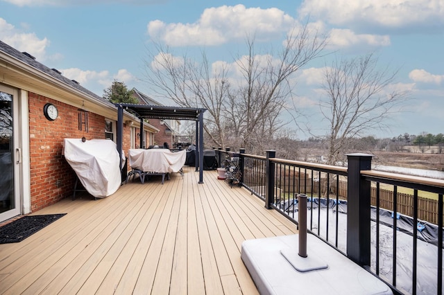 wooden deck featuring area for grilling