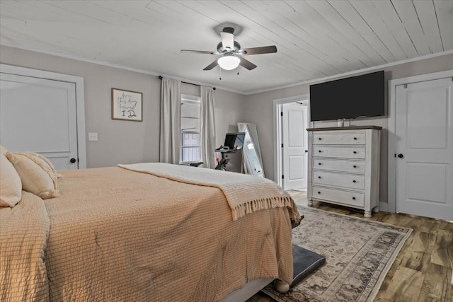 bedroom featuring crown molding, ceiling fan, wood ceiling, and hardwood / wood-style floors