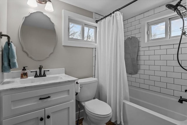 full bathroom with vanity, toilet, and shower / bath combo