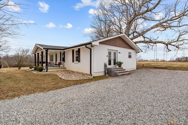 exterior space with french doors and covered porch