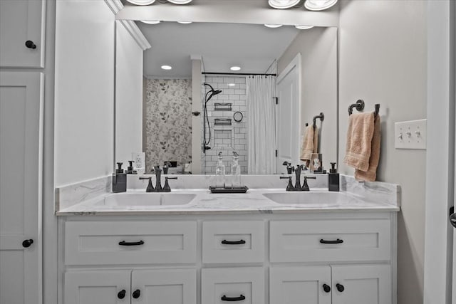 bathroom with walk in shower and vanity