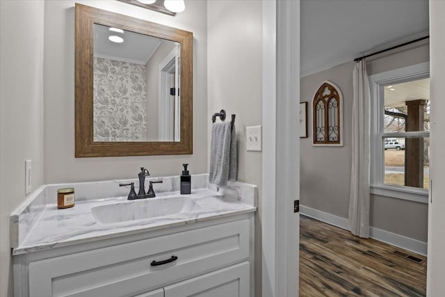 bathroom featuring hardwood / wood-style flooring and vanity