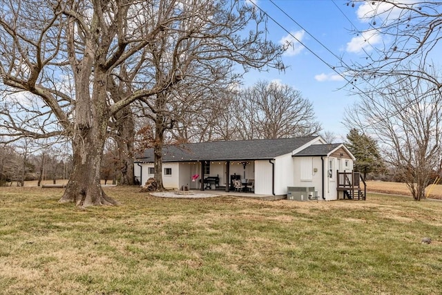 back of property featuring a yard, a patio, and central air condition unit