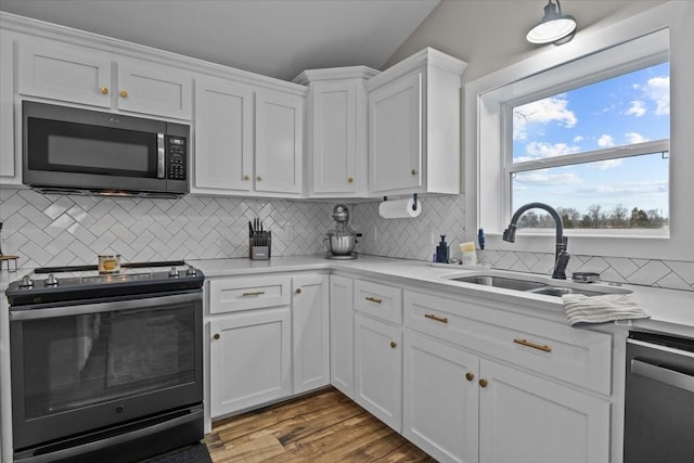 kitchen featuring range with electric stovetop, black dishwasher, sink, and white cabinets