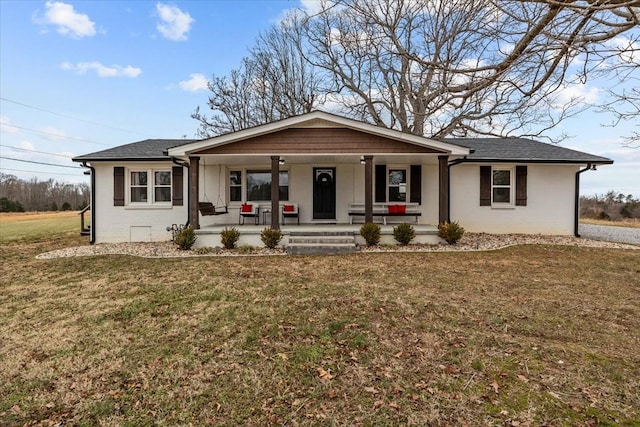 single story home featuring a front yard and covered porch