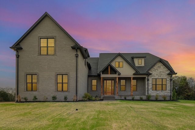 view of front of home with a lawn