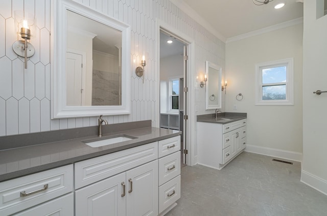 bathroom with vanity and ornamental molding