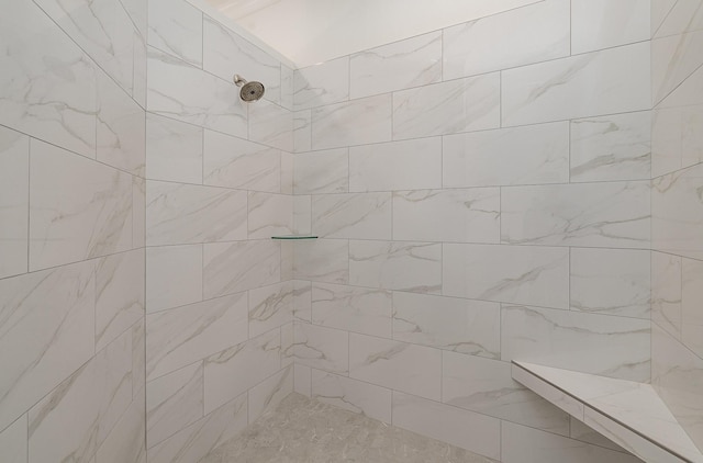 bathroom featuring tiled shower