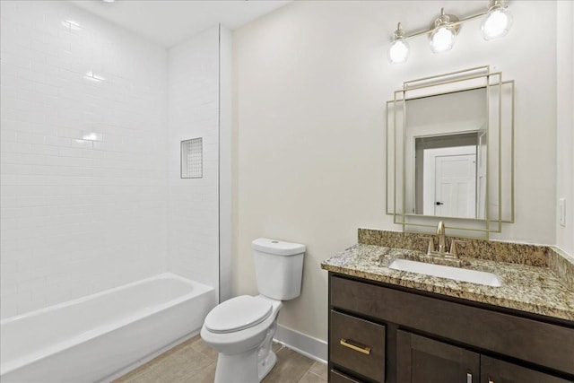 full bathroom with vanity, tiled shower / bath, and toilet