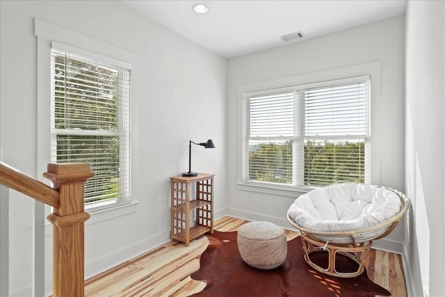 sitting room with light hardwood / wood-style floors