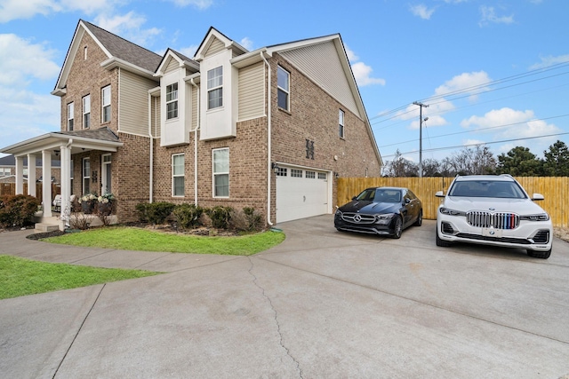 view of side of property with a porch and a garage