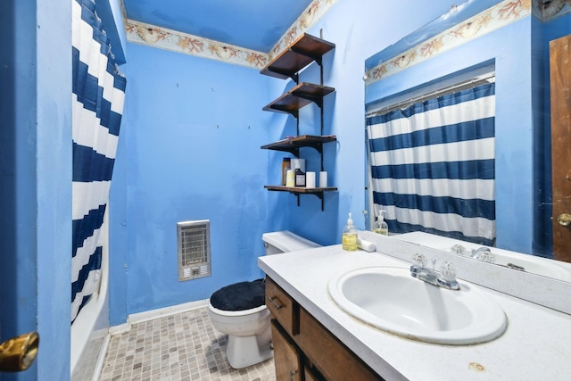 full bathroom with vanity, heating unit, toilet, and shower / bath combo with shower curtain