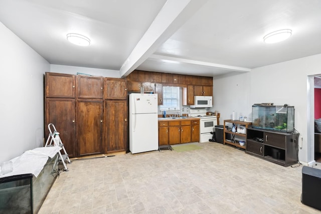 kitchen featuring white appliances, beam ceiling, and sink