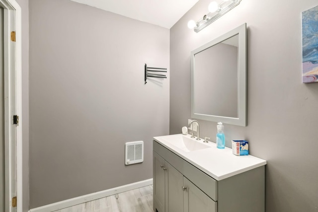 bathroom with vanity and hardwood / wood-style floors