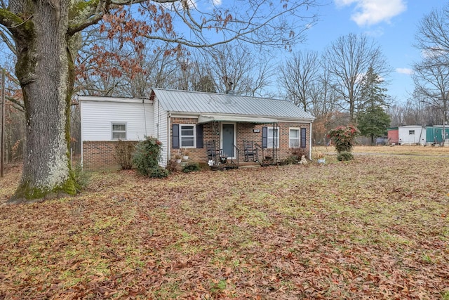 single story home featuring covered porch