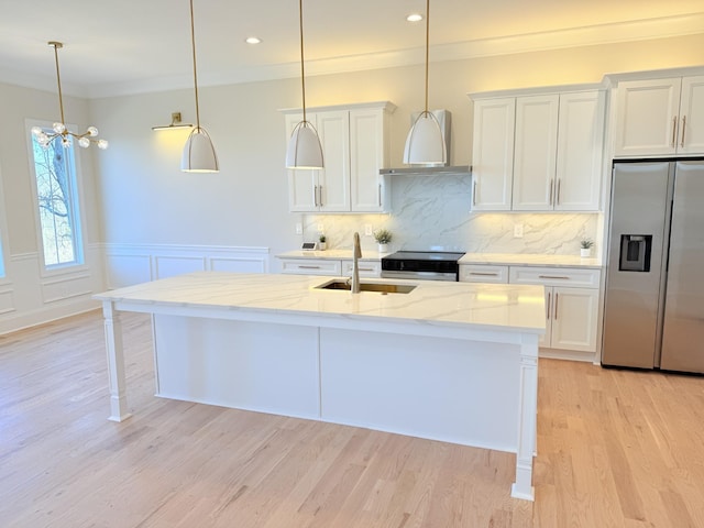 kitchen featuring sink, white cabinetry, light stone countertops, a center island with sink, and stainless steel fridge with ice dispenser