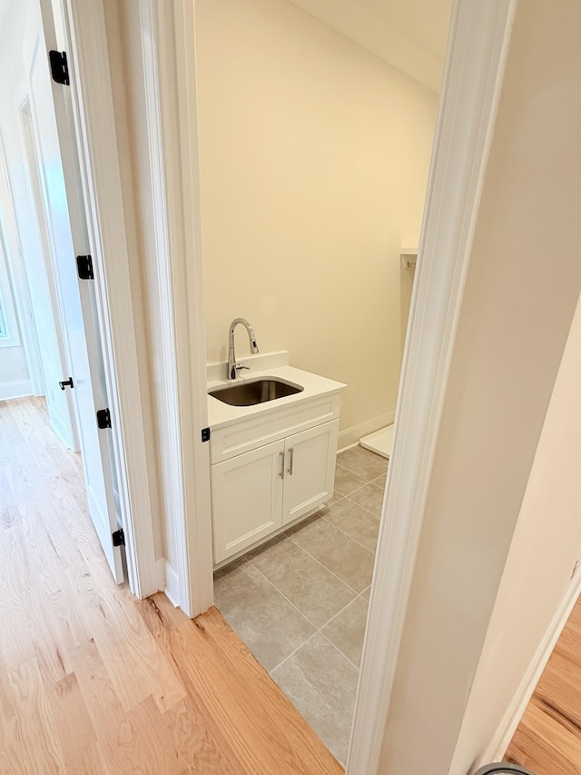 bathroom with vanity and wood-type flooring