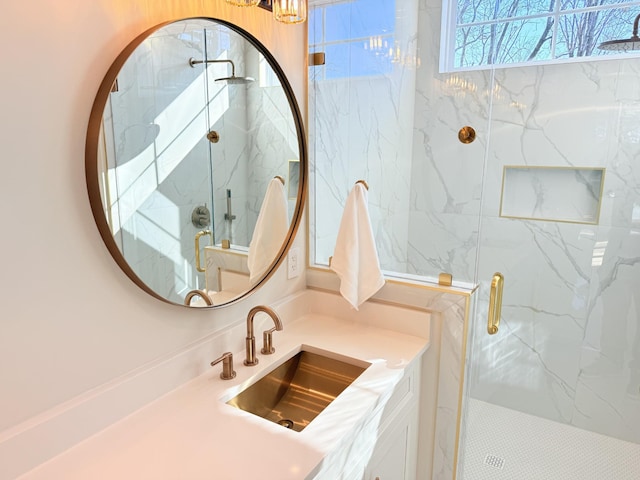 bathroom featuring vanity and a shower with shower door