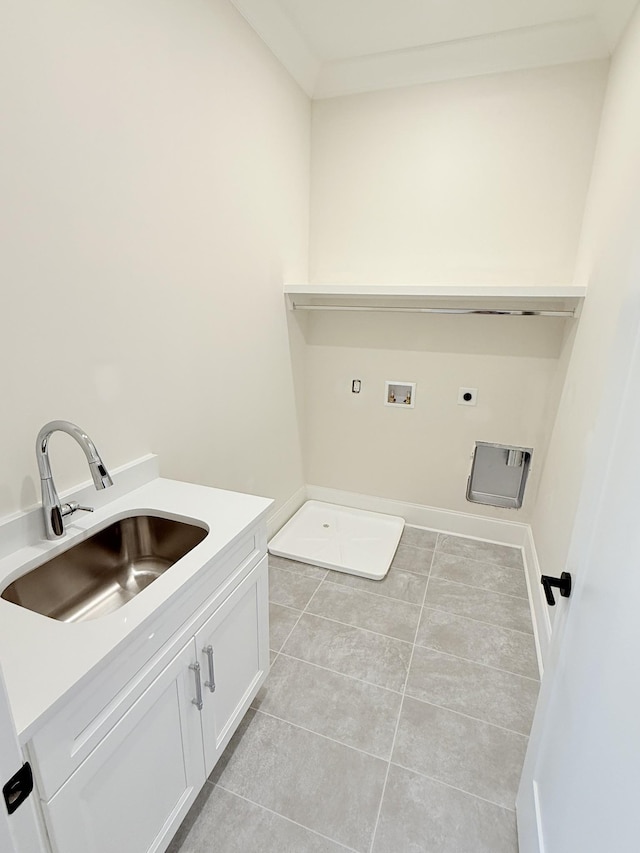 washroom featuring sink, light tile patterned floors, electric dryer hookup, hookup for a washing machine, and cabinets